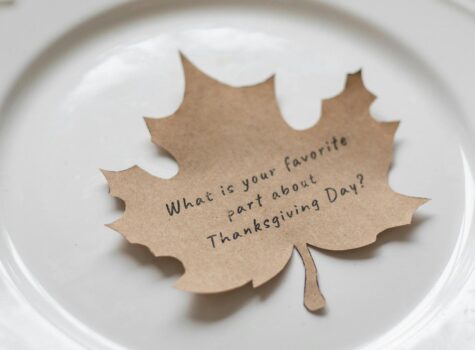 brown leaf on white plate that says what is your favorite part of thanksgiving